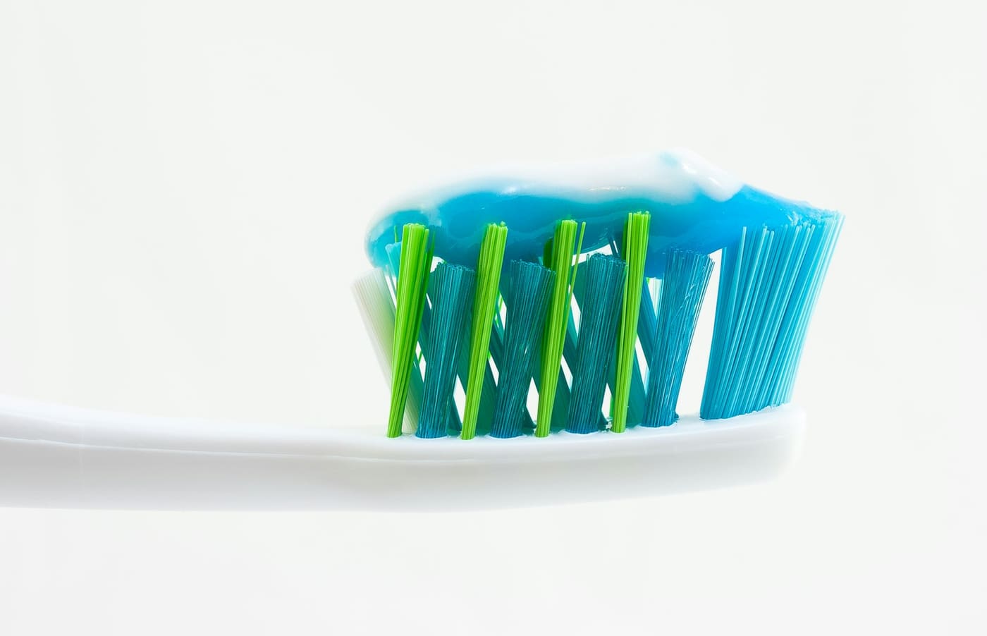 Toothbrush with toothpaste on a white background